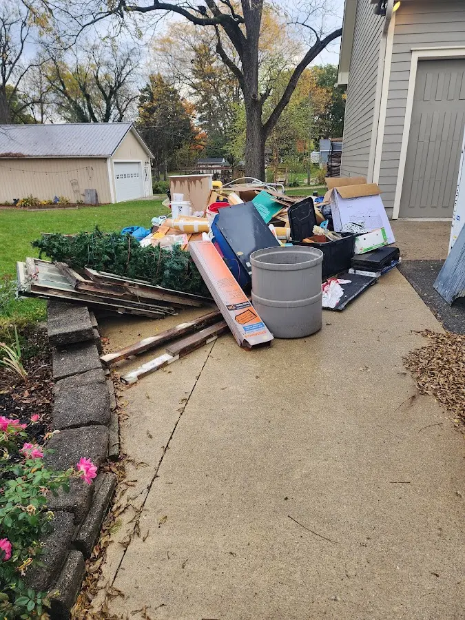 Dumpster being loaded with debris for Estate Cleanout Dumpster Rental in Duryea